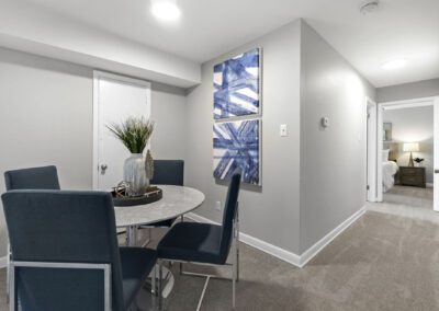 A dining room featuring a table surrounded by chairs, creating an inviting space for meals and gatherings